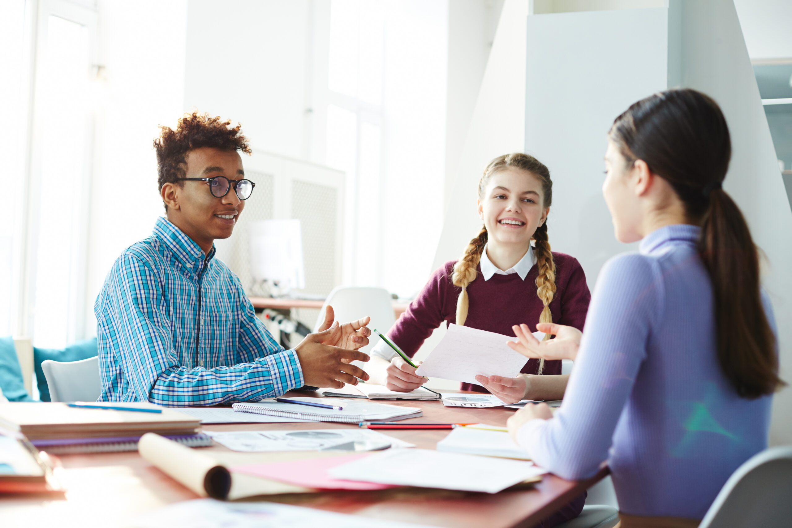 Three interns working together during their marketing internship.